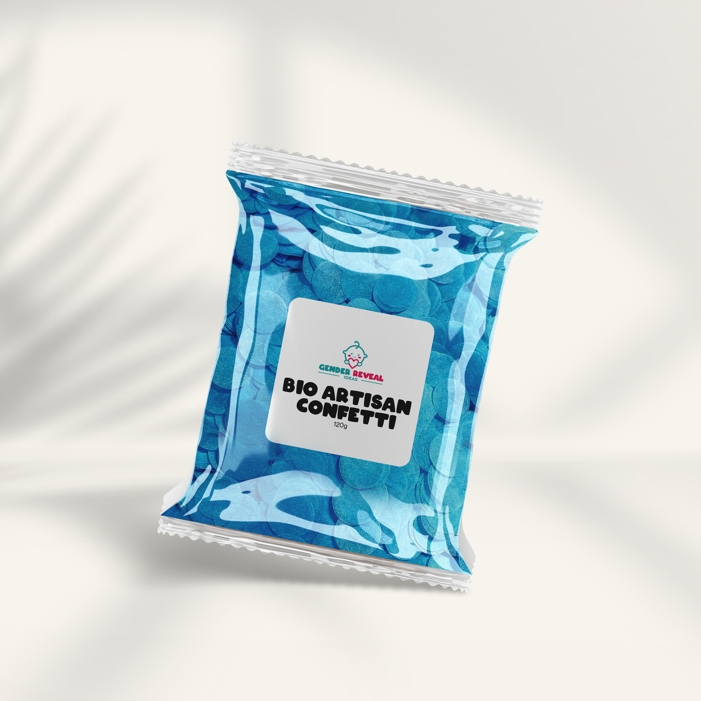 120g BIO Gender Reveal Confetti - Artisan package shown in transparent blue packaging with white label, displayed on light background with subtle shadow effect. Eco-friendly biodegradable confetti visible through clear packaging.