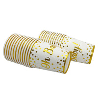 Oh Baby gender reveal cups with elegant gold stripes and polka dots on white background, stacked decoratively
