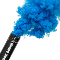 Black smoke bomb releasing dense blue powder smoke for gender reveal celebration event backdrop