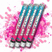 Mega Reveal Gender Party Bundle featuring four teal and pink bio-cannon confetti launchers arranged diagonally against a white background with vibrant pink powder and confetti scatter effects, creating an energetic and festive product display for gender reveal celebrations