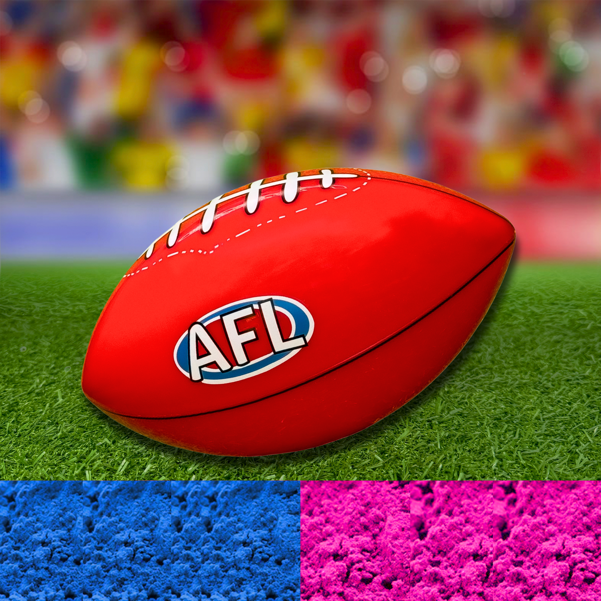 Sports Gender Reveal AFL Ball featuring a red Australian Football League ball on synthetic grass, with pink and blue powder samples shown below, perfect for announcing your baby's gender in true Aussie style.