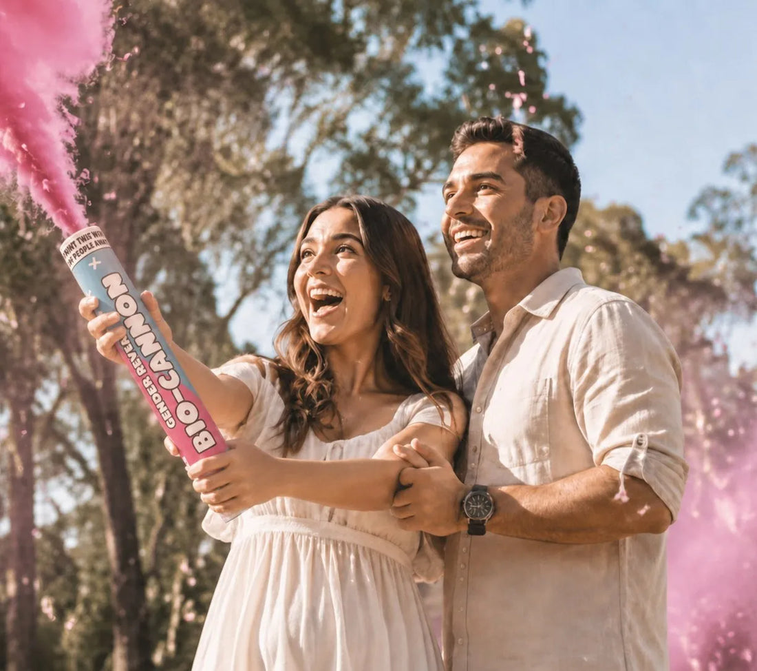 Couple celebrating a gender reveal, firing a pink BIO-CANNON outdoors